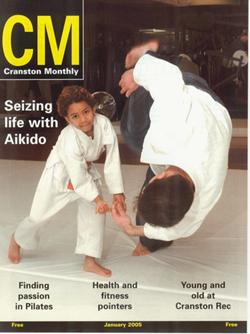 Picture: Eight-year-old Aikido student Jaxine Wolfe flips Mr. Michael L. Werth Sensei at Aikido � Downtown in Providence in January of 2005.